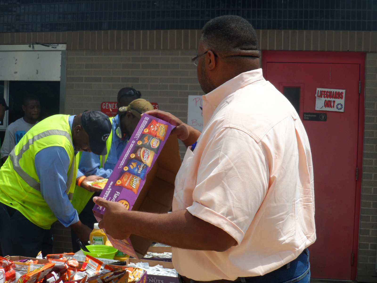 Mayor Glover helping with food service
